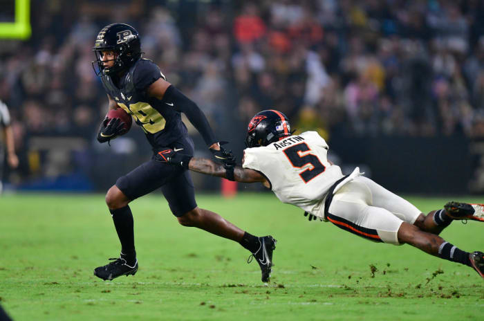 Purdue wide receiver Broc Thompson (29) jukes Oregon State defensive back Alex Austin (5).